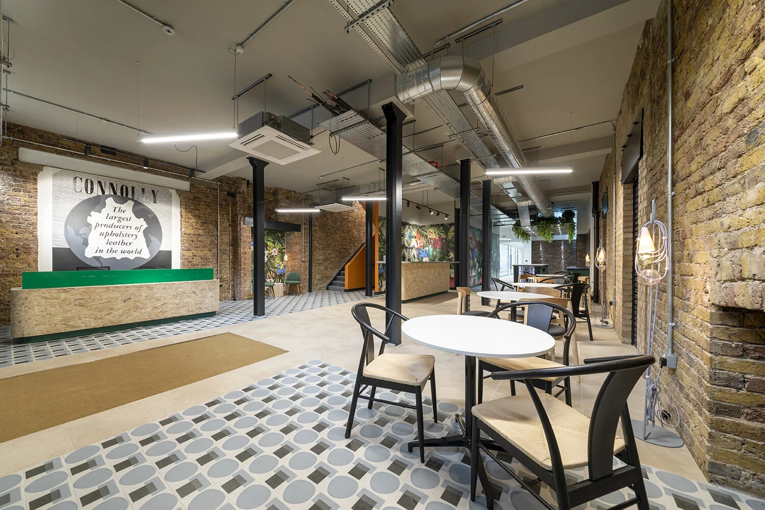 Reception at The Connolly Works, with the Connolly Leather mural painted on the brick wall